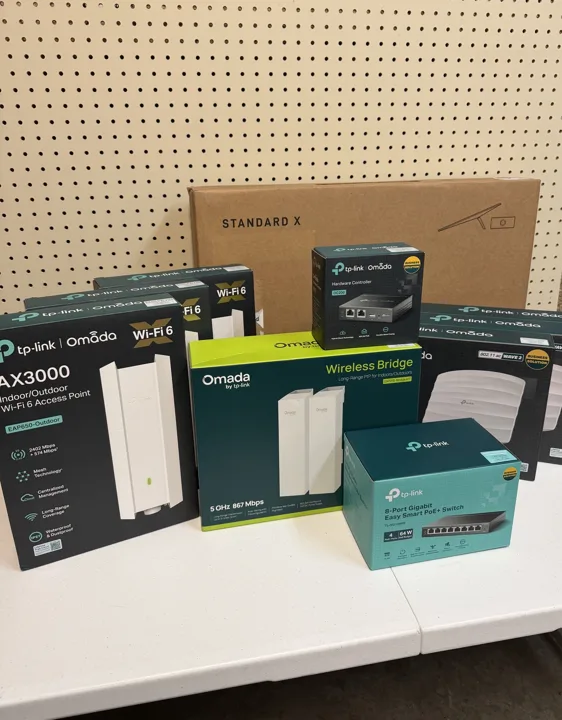 Starlink kit and TP-Link networking equipment prepared for installation