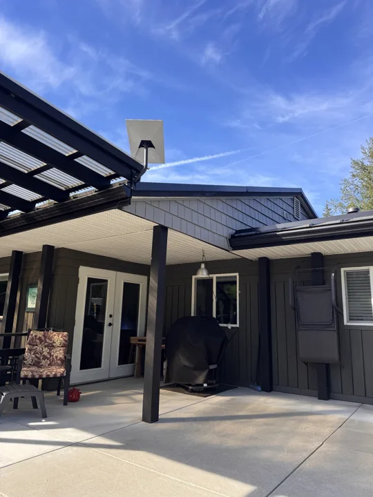 Starlink dish mounted above a covered patio